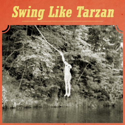 Vintage man swinging on rope.