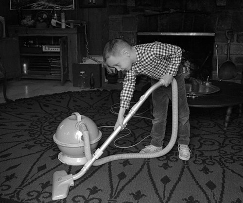 2012-09-18_2032 Vintage young boy vacuuming floor doing chores.