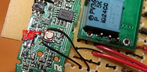 Vintage new wires connected to the field phone's receiver switch terminals.