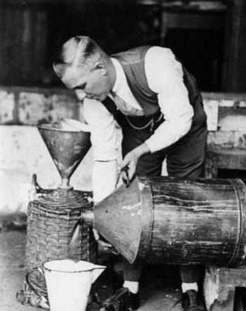 Vintage bootlegger homebrewing alcohol 1920s.
