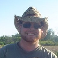 closup Dan's Archaeologist smiling for a picture while wearing sunglasses and head.