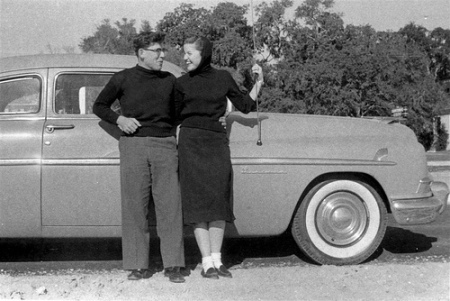 couple3 Vintage couple standing in front of car.