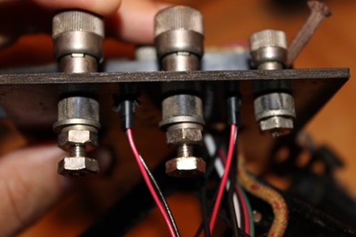 Vintage one black wire and one red wire connected to each light.