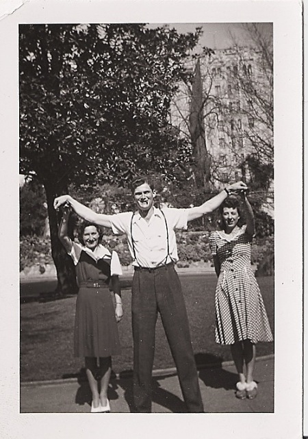 manwomen Vintage two women giving pose with man at outside.