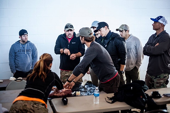 Treating Bullet wound on slab of pork Atomic athlete vanguard.