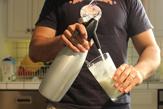 Men dropping milk in the glass.