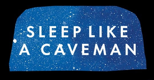 Text saying "SLEEP LIKE A CAVEMAN" over a blue, starry background, inviting listeners to explore the primitive art of rest.