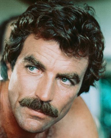 Tom Sellack as Magnum P.I. Tom Selleck posing with mustache.
