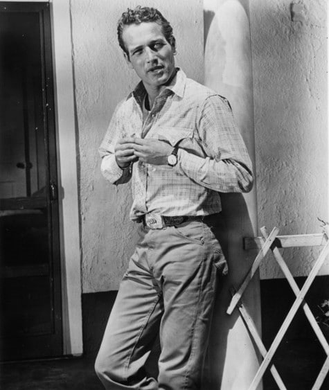 Vintage man wearing button shirt with tucked pant.