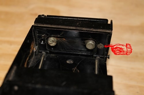 Vintage two screws on the underside of the receiver.