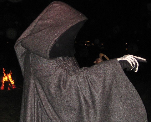 grim reaper Halloween man dressed as stalker.