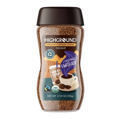 A jar of Highground Organic Fairtrade instant coffee, often considered among the best instant coffee options, with a dark brown lid and various certification labels on the front.