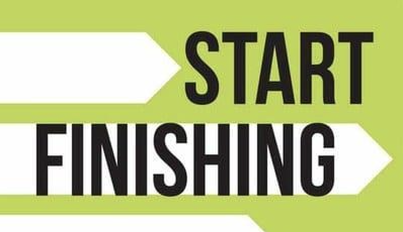 A green and white sign that says "Start Finish.